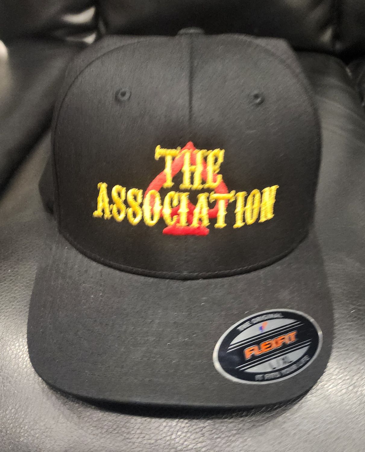Hat w/Road Name- New The Assoc Black L/XL