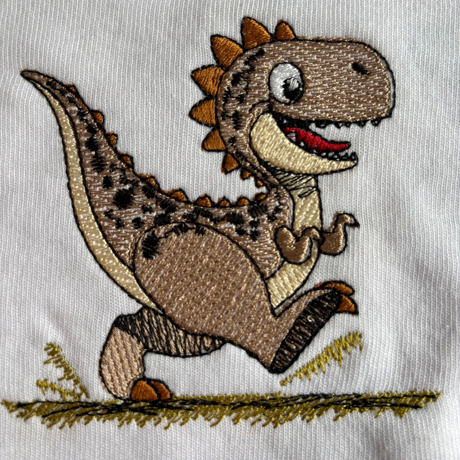 Tan Dinosaur Bib