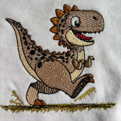 Tan Dinosaur Bib