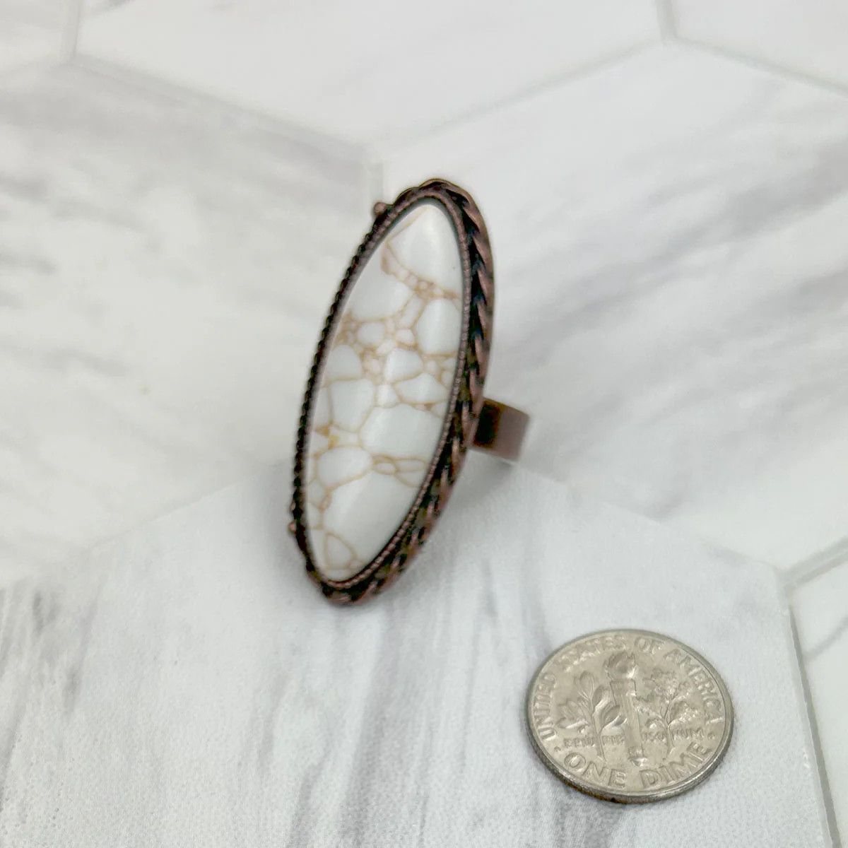 COPPER METAL WITH WHITE OVAL RING