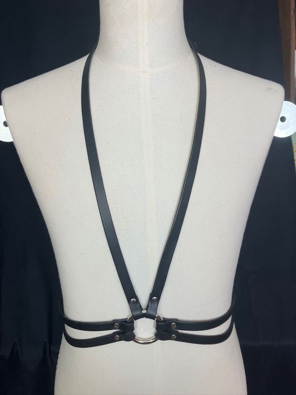 The Downright Harness in black displayed on a mannequin. Long low V front, with double strap waist belt.