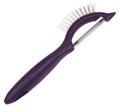 Vegetable peeler with brush