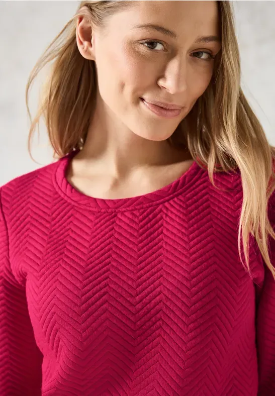 Pull framboise à motifs structuré