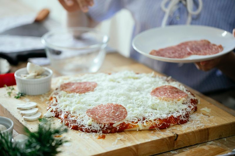 Pizza Deluxe (Cheese, Salami, Mushrooms, Capsicum, Chicken Frankfurters and Pimentos)