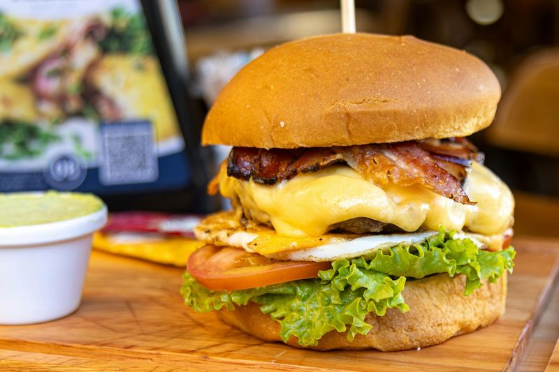 "Cheese Burger with Beef Patty at Pizza Corner UAE - Juicy Beef Patty Topped with Melted Cheese, Fresh Lettuce, Tomato, and Cucumber in a Soft Bun"