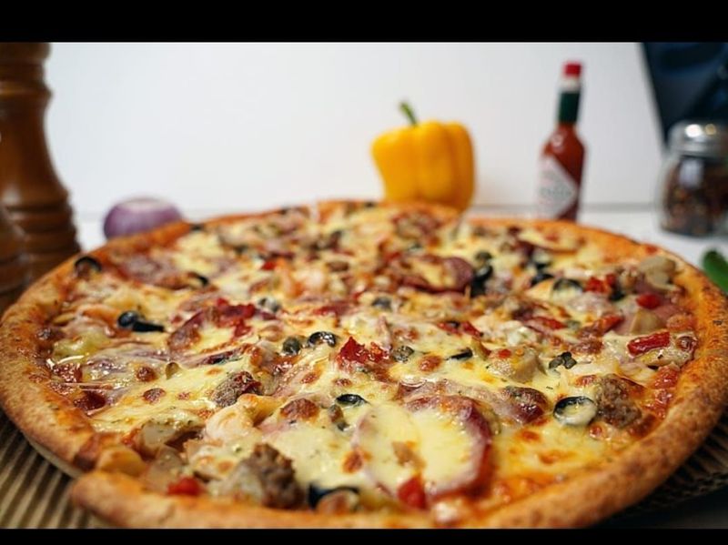 Pizza Supremo (Cheese, Beef Salami, Shrimps, Chicken Frankfurters, Beef Pepperoni, Ground Beef , Mushroom, Green and Black Olives, Capers and Pimentos) Pizza Supremo at Pizza Corner UAE - Loaded with Premium Toppings for the Ultimate Flavor Experience