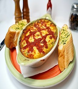 "Lasagne Verde at Pizza Corner UAE - Layered Pasta with Spinach, Rich Tomato Sauce, and Melted Cheese"