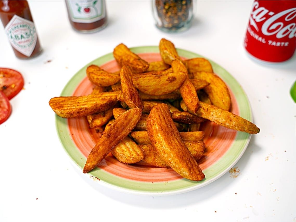 "Masala Potato Wedges at Pizza Corner UAE - Crispy and Spiced to Perfection for a Flavorful Snack"