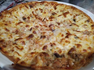 "Pizza Fritti di Mare at Pizza Corner UAE - Topped with Fresh Seafood, Including Shrimp, Calamari, and Mussels for a Flavorful Ocean-Inspired Pizza"