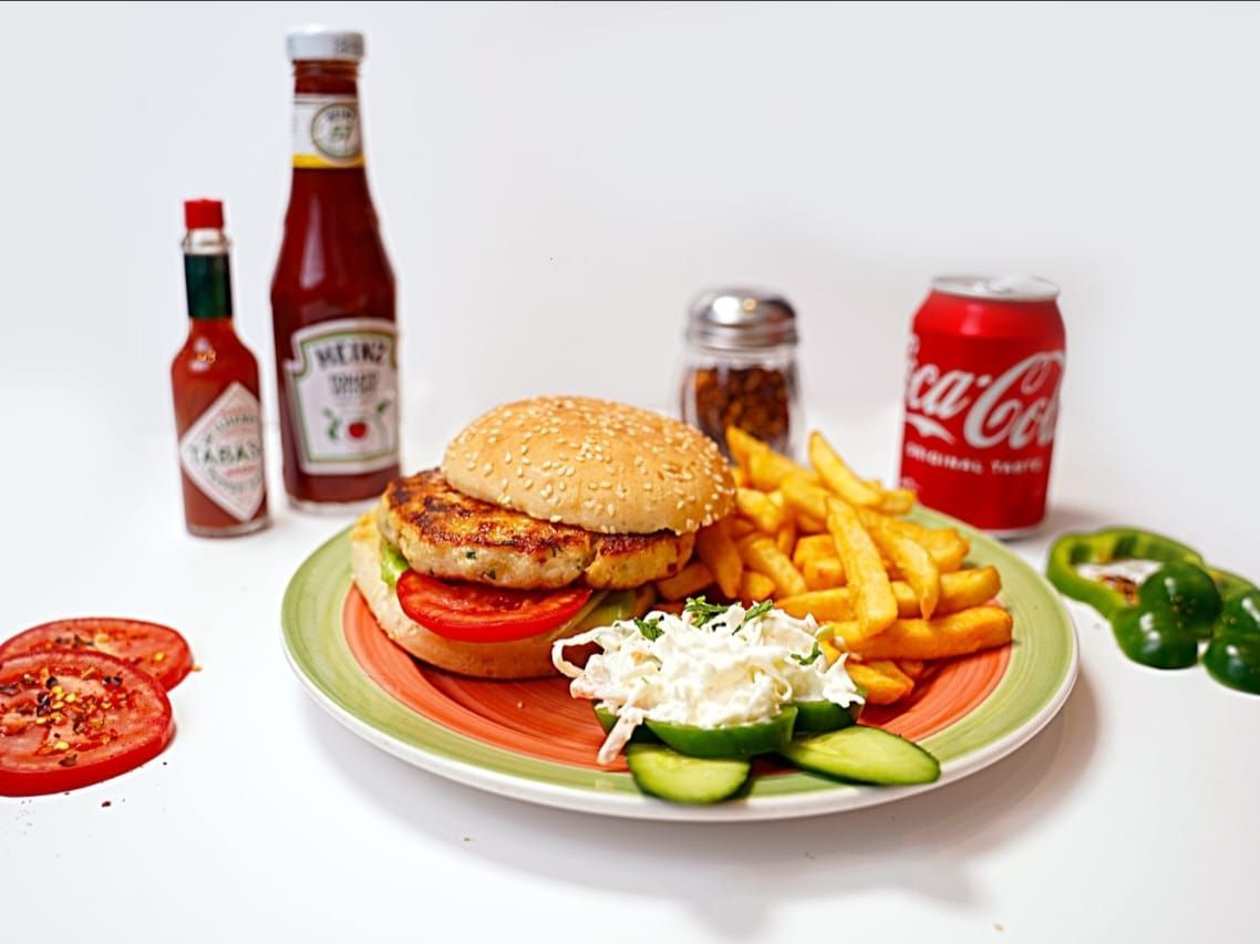 "Chicken Burger at Pizza Corner UAE - Juicy Grilled Chicken Patty with Fresh Lettuce, Tomato, and Cheese in a Soft Bun"