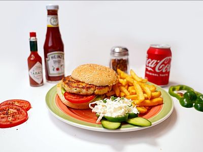 "Chicken Burger at Pizza Corner UAE - Juicy Grilled Chicken Patty with Fresh Lettuce, Tomato, and Cheese in a Soft Bun"