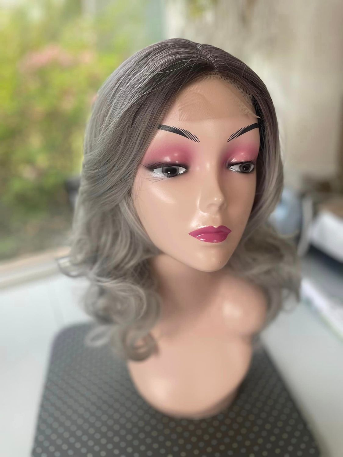 ​Soft lace front, long wavy gorgeous grey with darker roots.