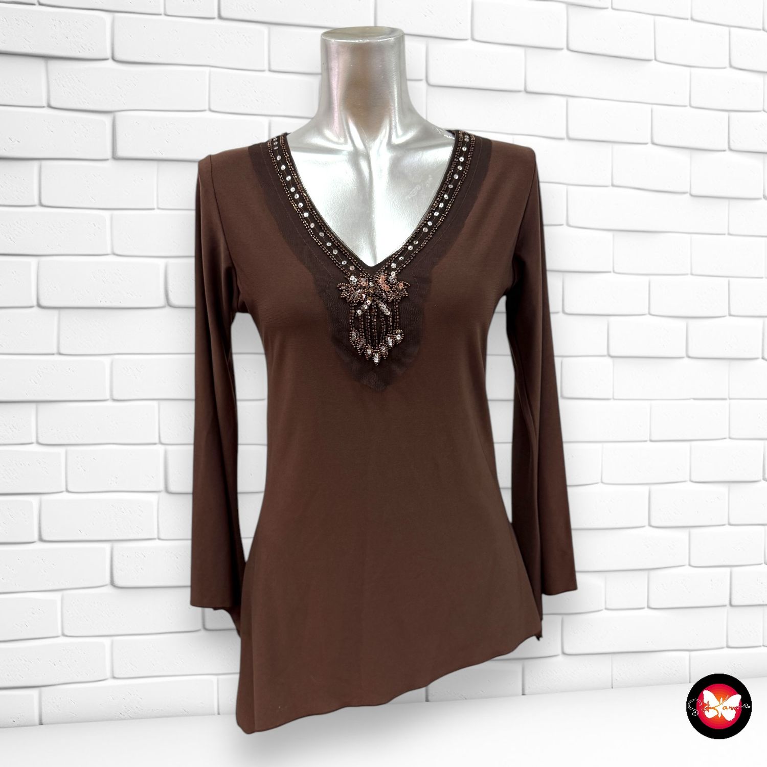 Blusa de manga larga con bajo asimétrico Talla S/M
