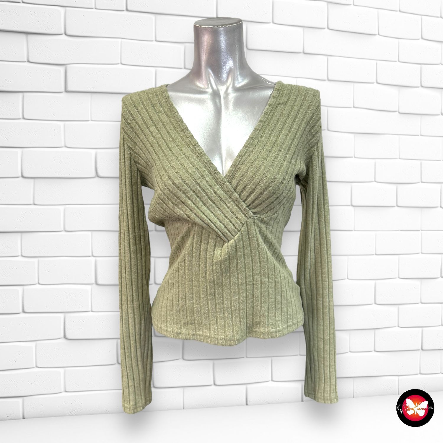 **SALES** Jersey canalé con escote cruzado Talla S