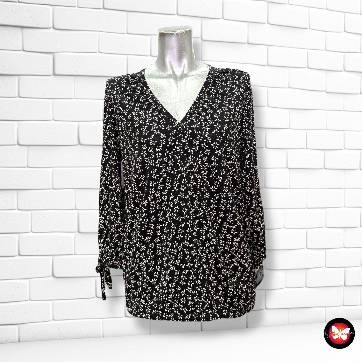Blusa de media manga con florecitas Talla M