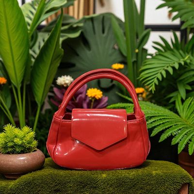MINI bolso de mano acharolado