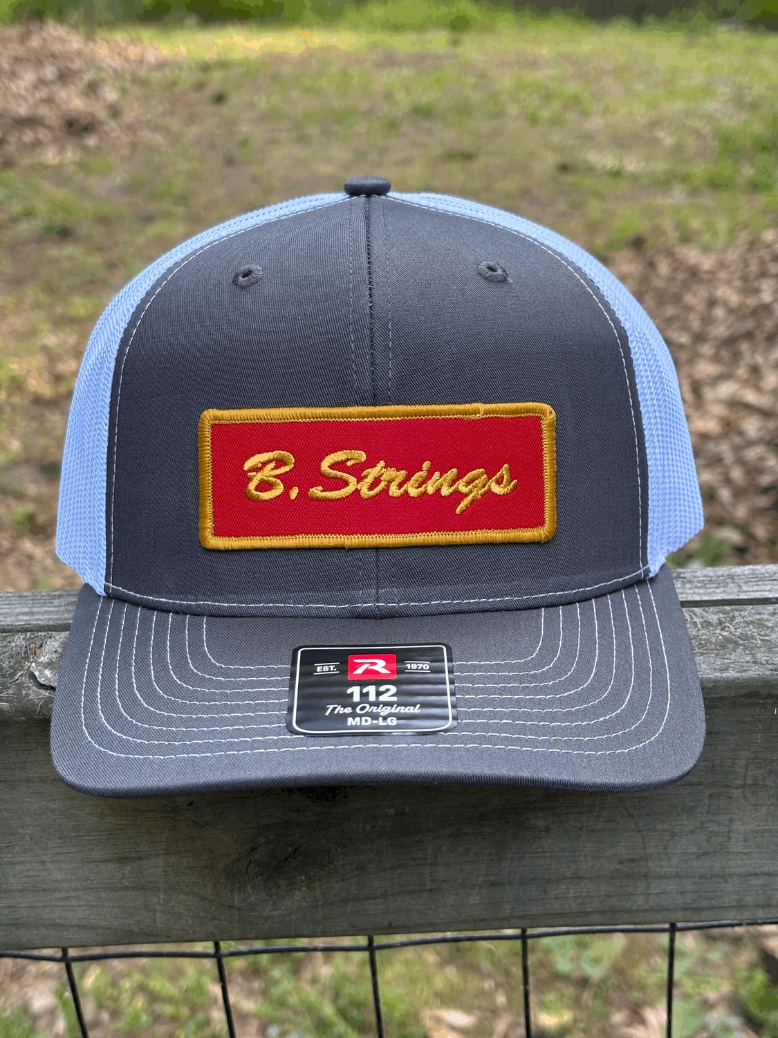 B. Strings Trucker Hat Gray/White