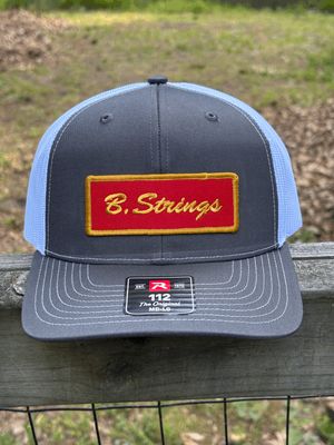 B. Strings Trucker Hat Gray/White