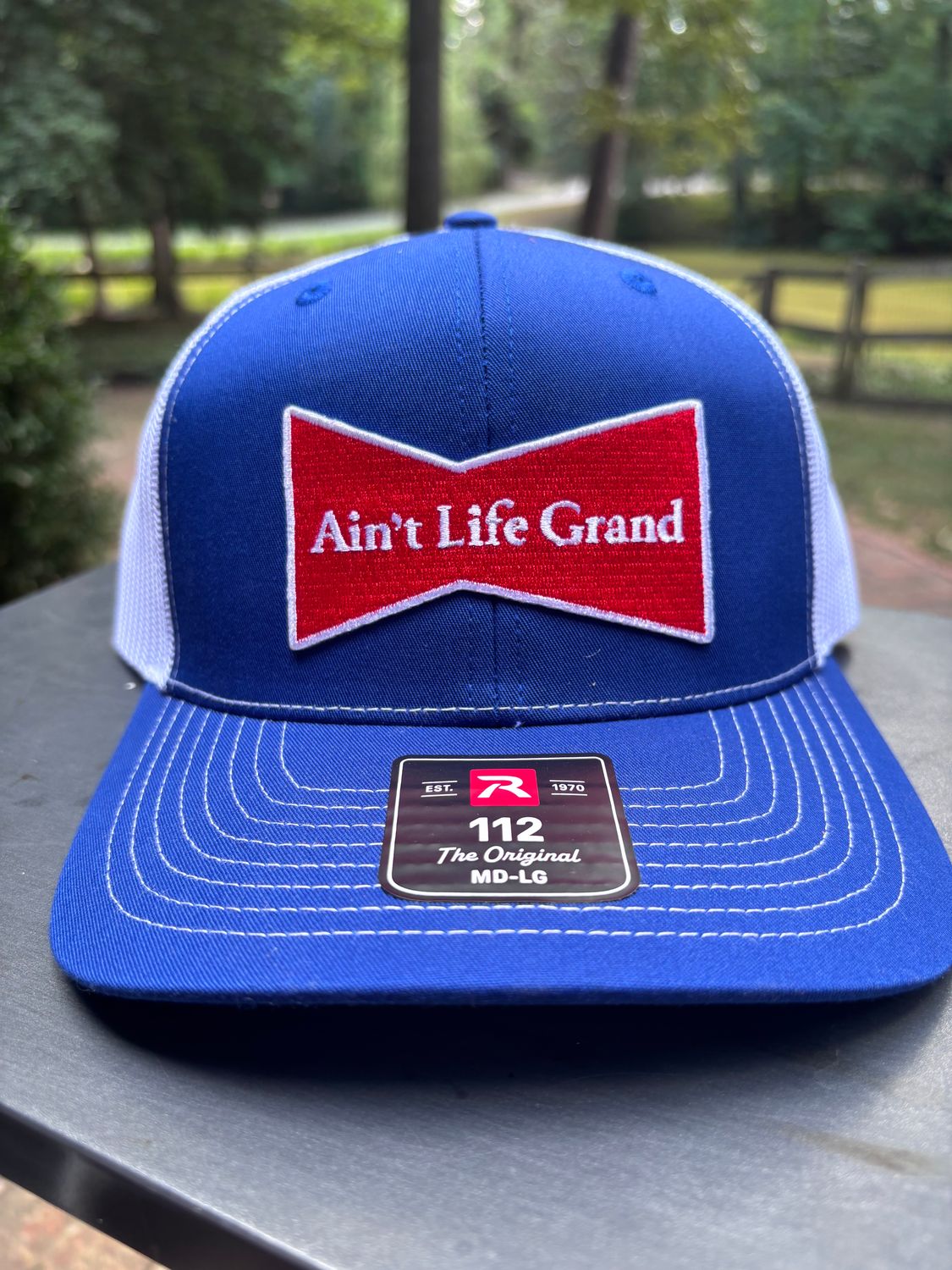 Ain't Life Grand Royal Blue/White Trucker Hat