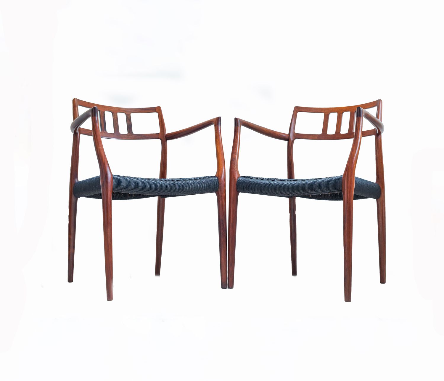 A Scarce Pair Of Niels Møller Model 64 Rosewood Carver Chairs For J L Moller, Denmark.