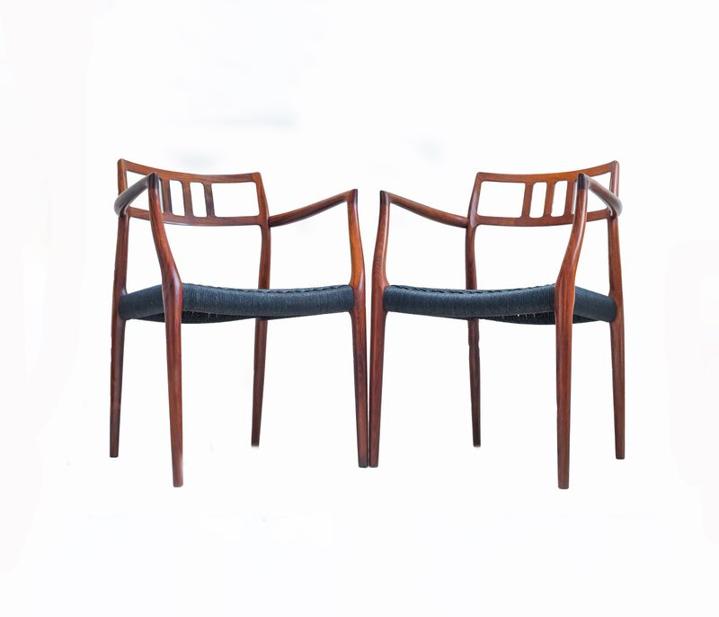 A Scarce Pair Of Niels Møller Model 64 Rosewood Carver Chairs For J L Moller, Denmark.