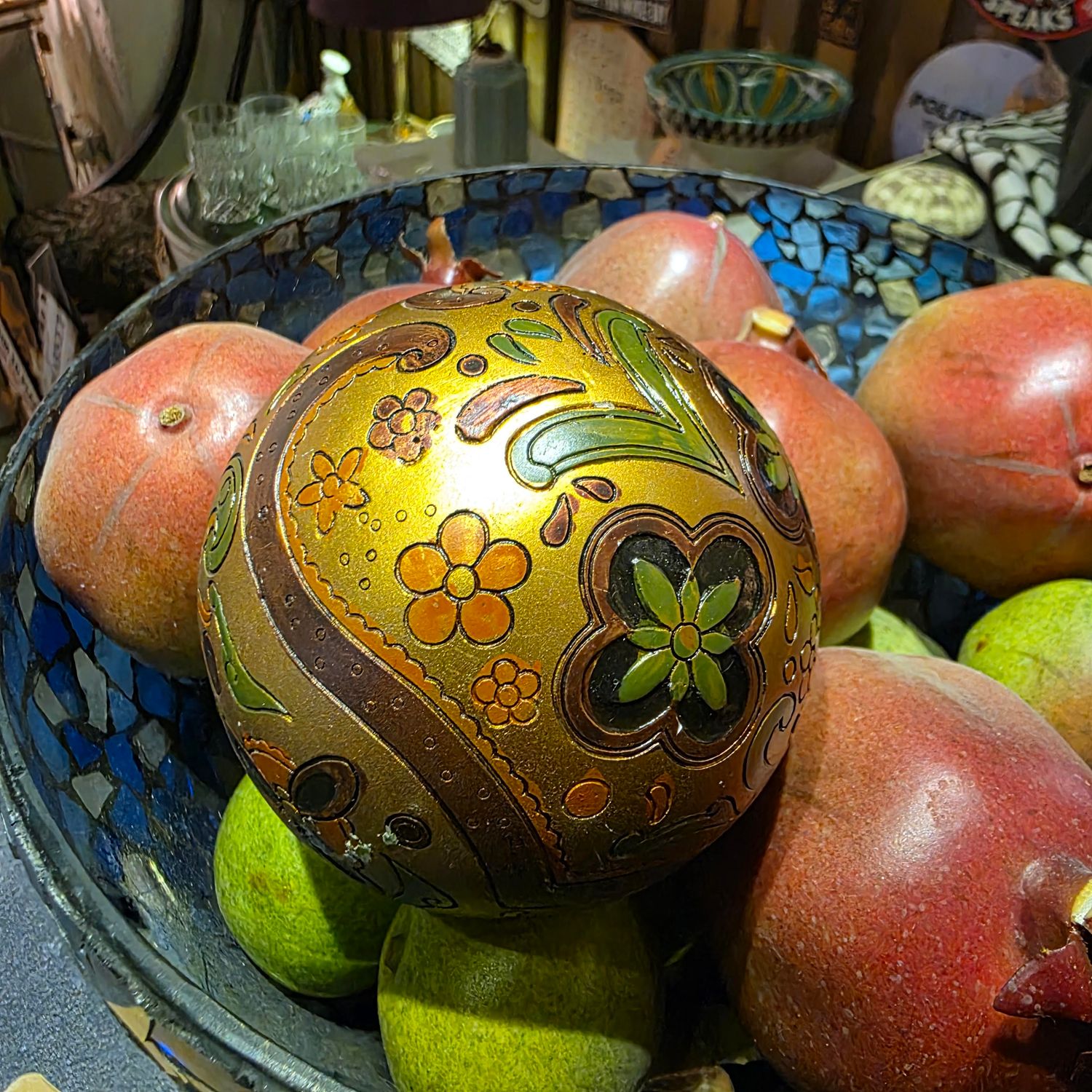 DECORATIVE SPHERE OR ORB WITH GOLD BROWN AND GREEN FLORAL AND PAISLEY PATTERN