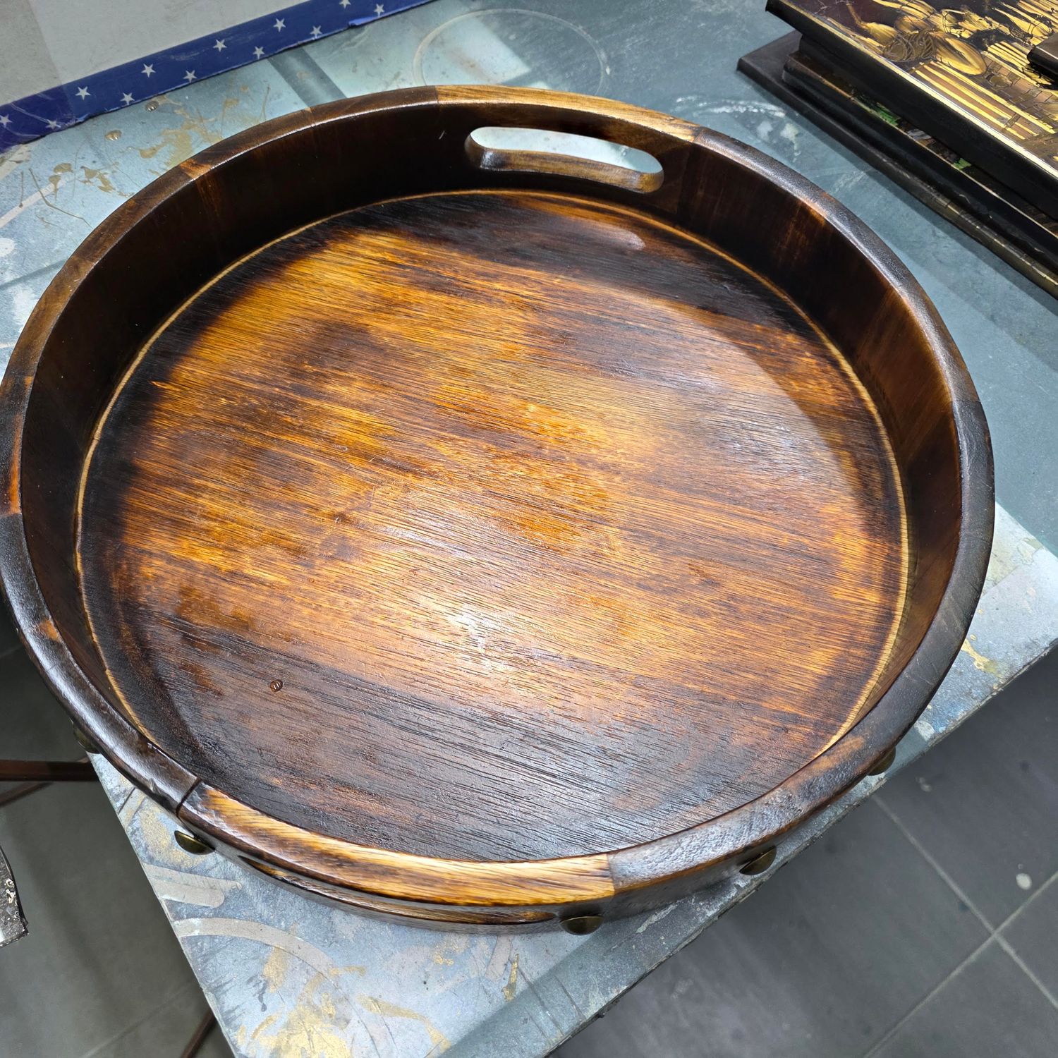 RUSTIC ROUND WOODEN SERVING TRAY WITH INTEGRATED HANDLES INLAID BRASS STUD.  ​