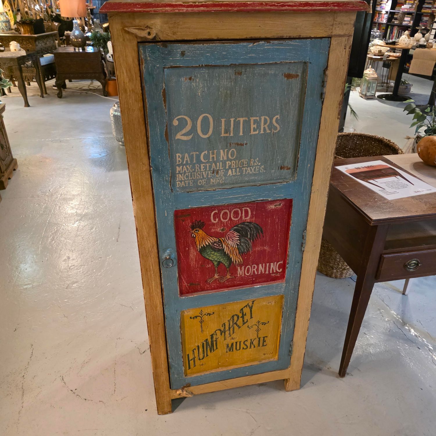 HANDPAINTED TALL VINTAGE ADVERT CABINET WITH A CARNIVAL COLLECTION DESIGN