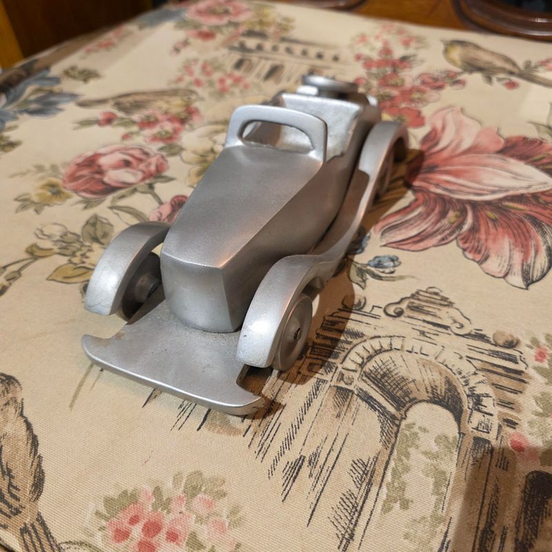VINTAGE POLISHED ALUMINUM CONVERTIBLE CAR MODEL, OFTEN USED AS A DECORATIVE DESK PIECE PAER WEIGHT OR BOOKEND