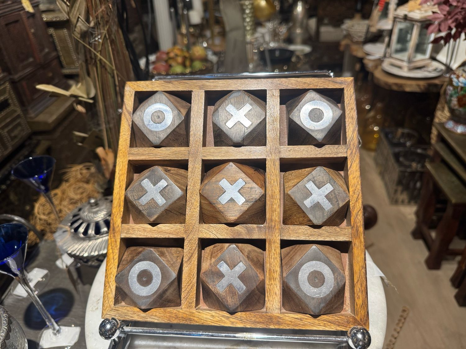 HANDCRAFTED WOODEN TIC TAC TOE SET SERVING AS BOTH A FUNCTIONAL TABLETOP GAME AND A DECORATIVE ITEM