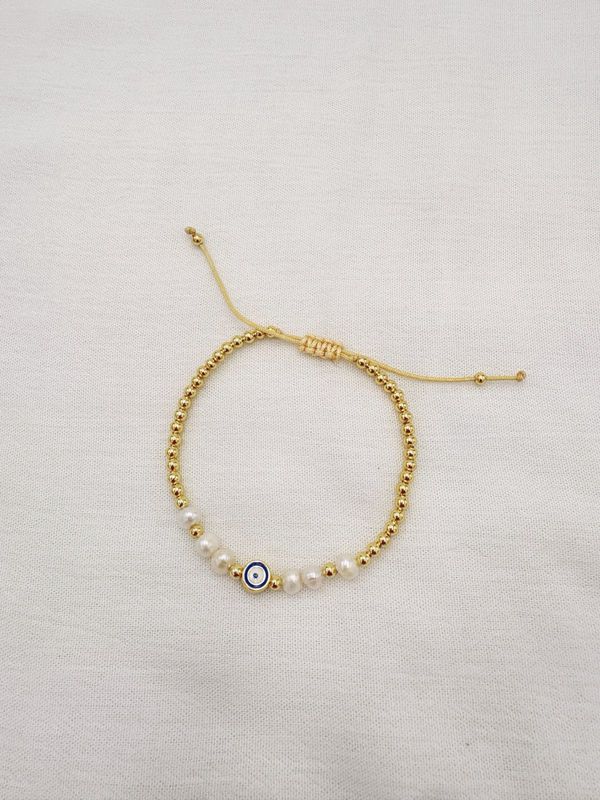 Pulsera de Ojo Turco con Perlas y bolitas doradas en acero bañado en oro de 18K  PU2061G47