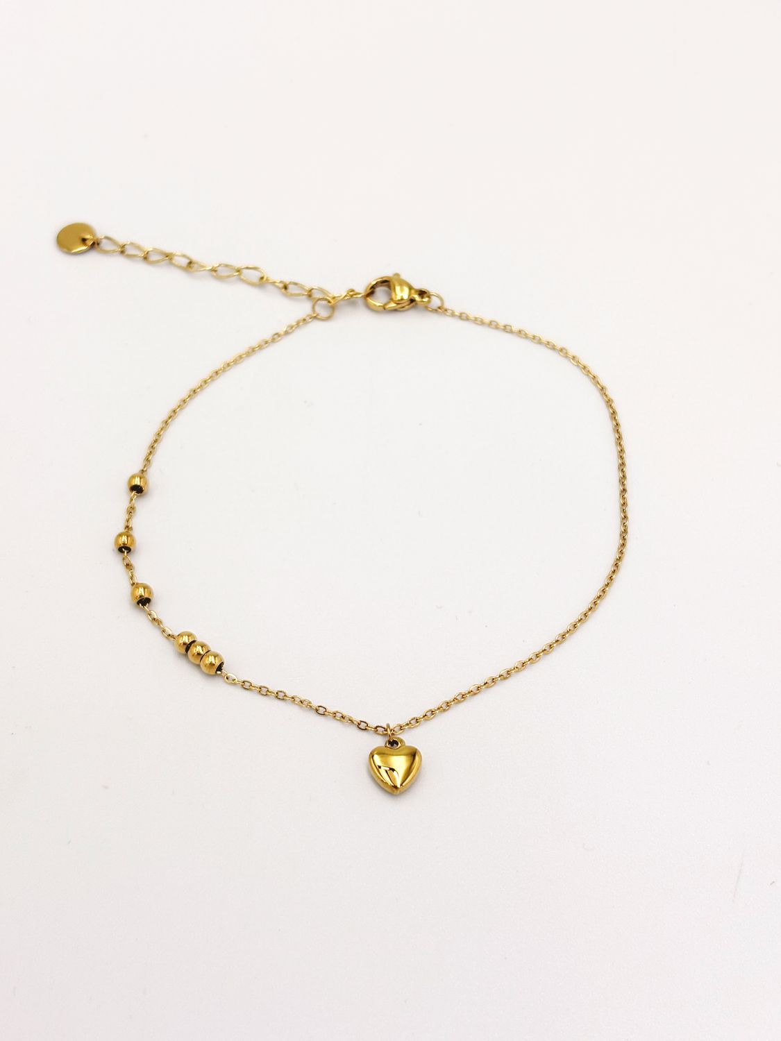 TOBILLERA DE ACERO DE CORAZÓN CON ESFERAS DORADAS TO0137G37