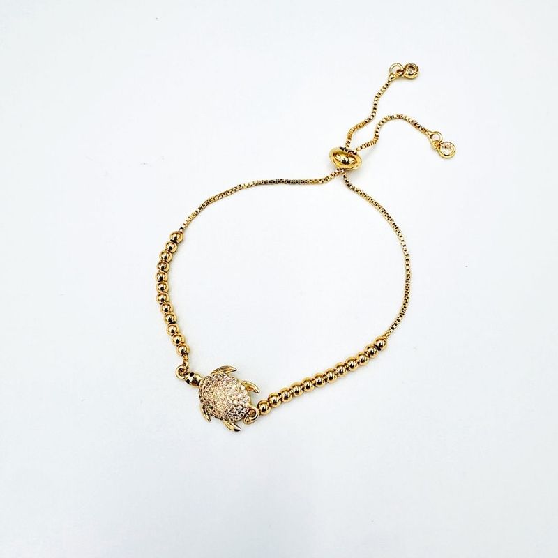 PULSERA CON DIJE DE TORTUGA EN BAÑO DE ORO Y CIRCONES PU2112G47 PULSERA CON DIJE DE TORTUGA EN BAÑO DE ORO Y CIRCONES PU2112G47