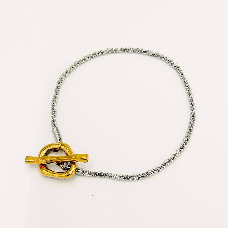 PULSERA PLATEADA CON CIERRE DORADO EN ACERO PU2127G141 PULSERA PLATEADA CON CIERRE DORADO EN ACERO PU2127G141