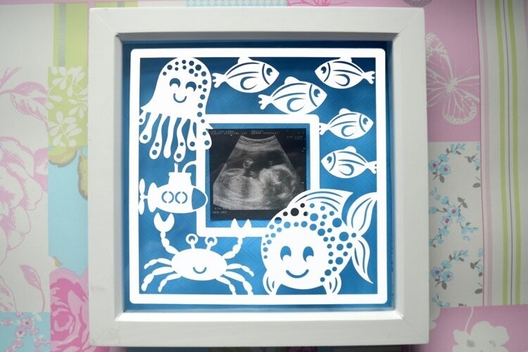 Fish frame, sea paper cut design
