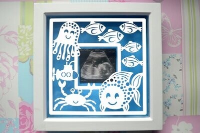 Fish frame, sea paper cut design