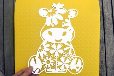 Cow paper cut design