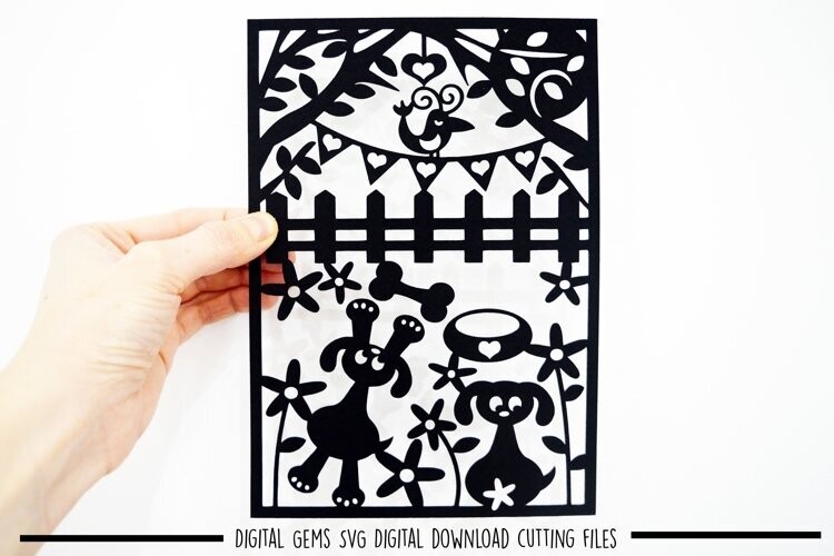 Dogs playing, paper cut design