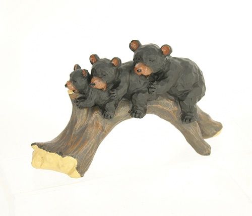 Bear family on log