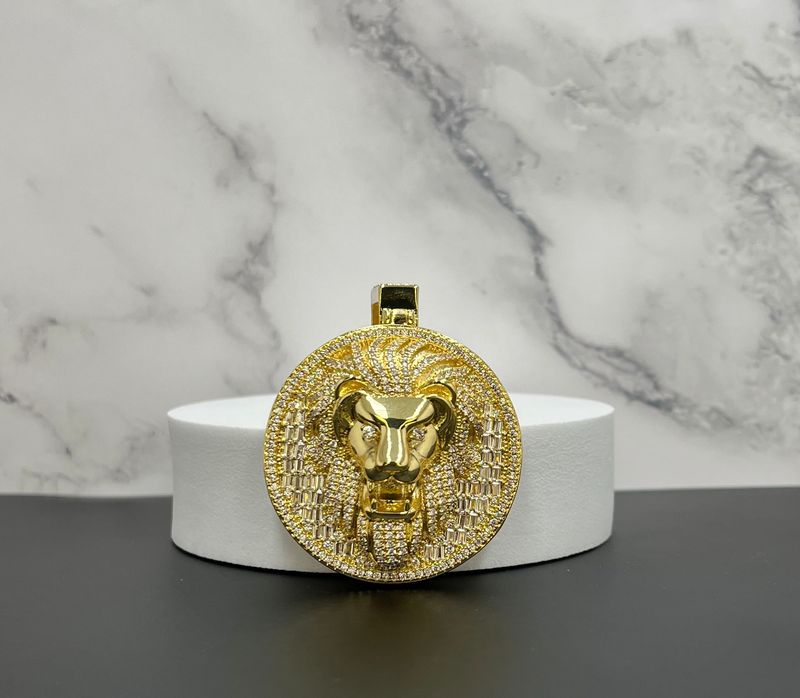 Dije laminado "Cara de león"