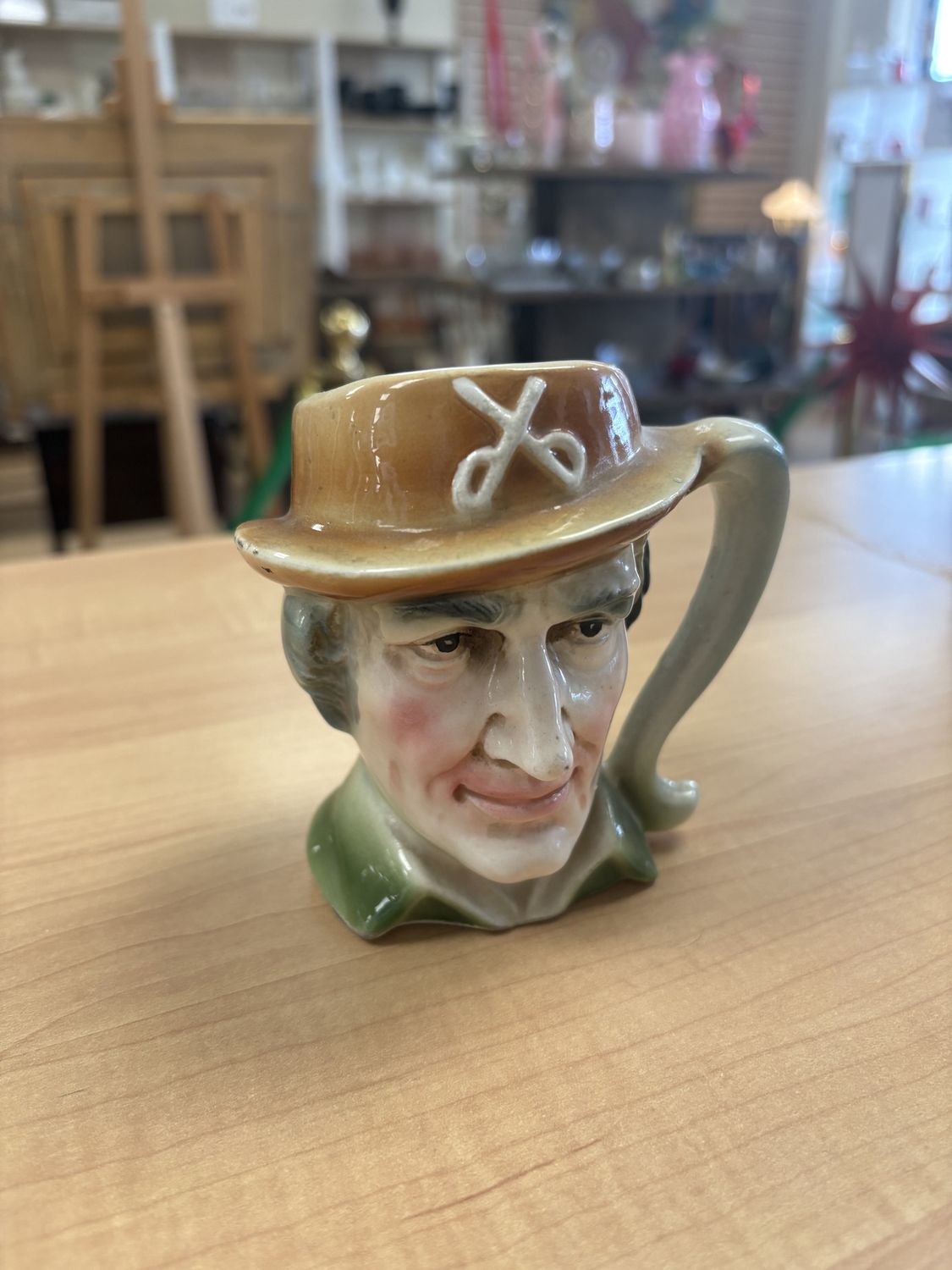 Porcelain. Japan. Royal Crown. Mug. Man with Green Shirt and Brown Hat with Scissors.