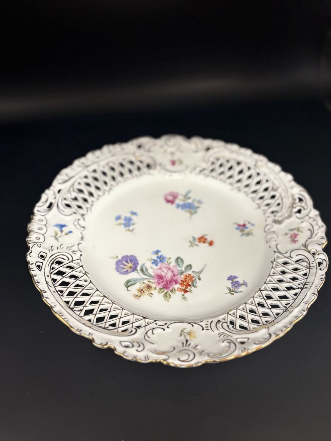 Porcelain. Germany. Hutschenreuther. Plate. Reticulated with Flowers. Pink Purple Orange Blue and Yellow. Gold Accents.