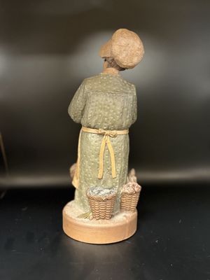 Sculpted Figure. USA. Tom Clark. Minnie. Signed. Woman Wearing Hat &amp; Apron, Feeding Chickens. 1992. 10''H