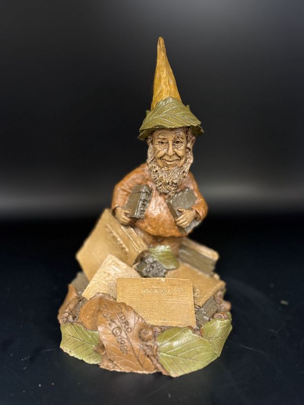Sculpted Figure. USA. Tom Clark.  Pedro. Gnome Surrounded by a Pile of Cairn Newspapers. 1986. 6&quot;H