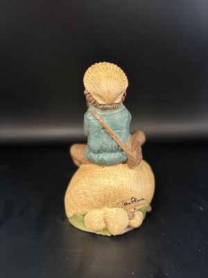 Sculpted Figure. USA. Tom Clark. Ivan. Signed. Man Sitting on a Seashell &amp; Using Another Shell as a Whistle. 1985. 6''H