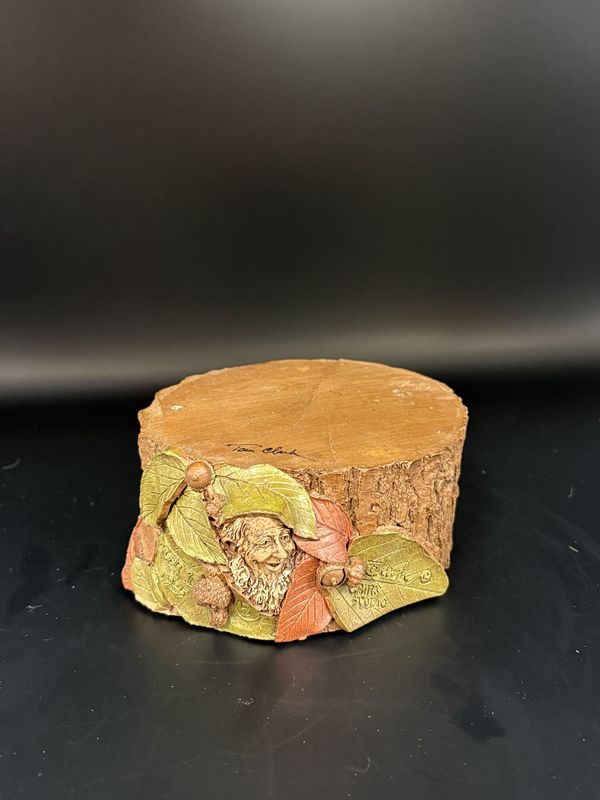 Sculpted Figure. USA. Tom Clark. Stump Riser. Tree stump with gnome face (green hat) and leaves on side. 1985. 2&#39;&#39;H.