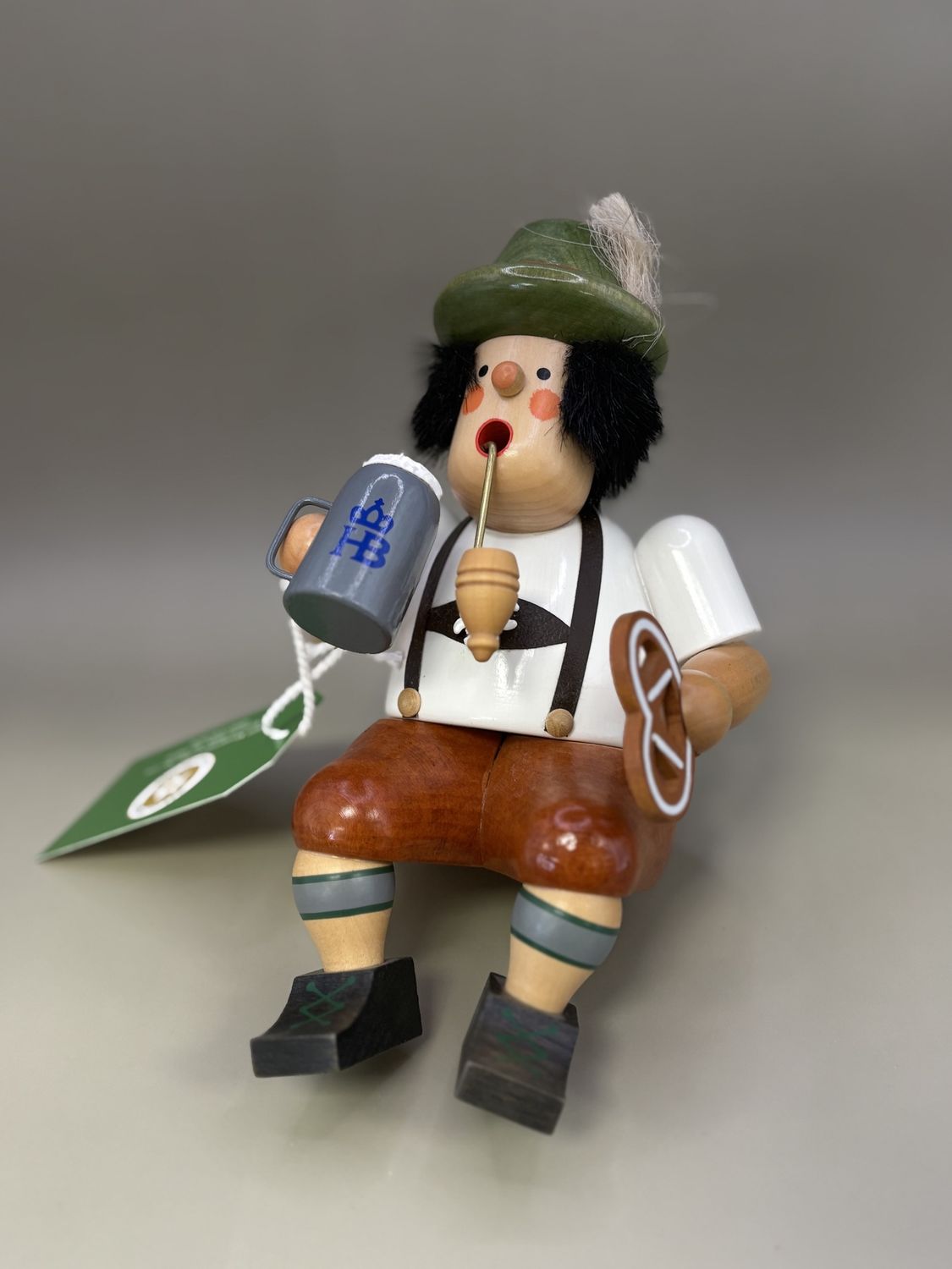 Smoker. Germany. Christian Ulbricht. Shelf-sitter: German man with pretzel and stein. 6.5&quot;H