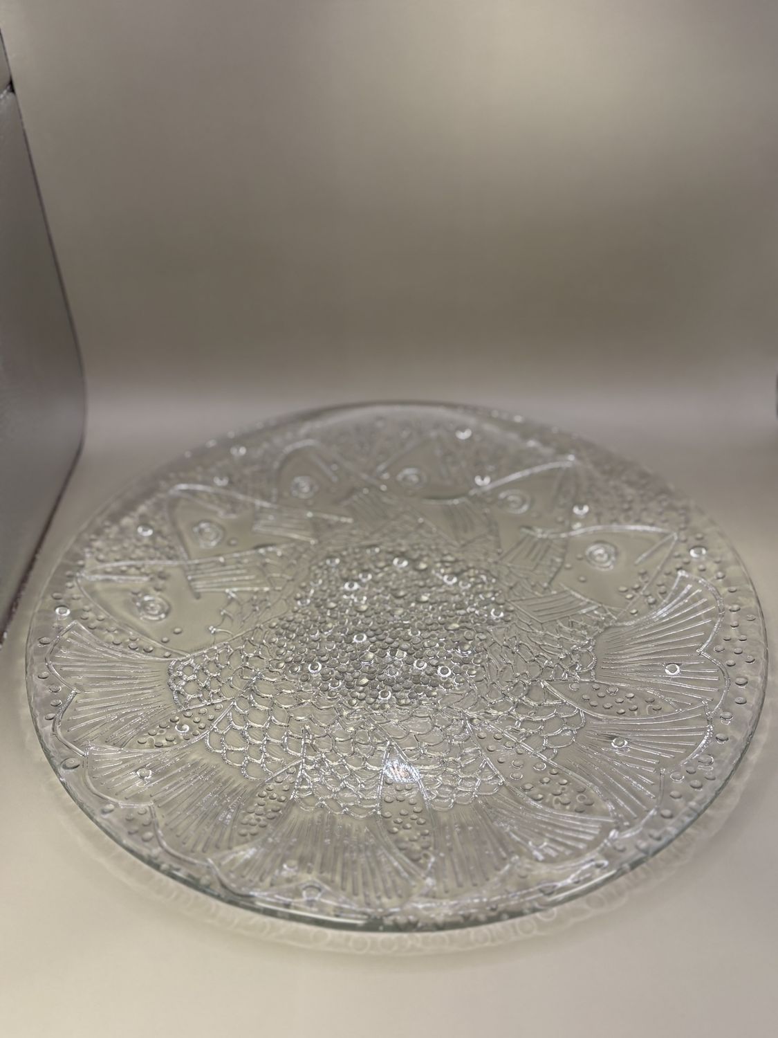 Glass. Sweden. Kosta Boda. Plate. Clear with Etched Design of Fish Clustered in the Center Radiating Outwards.