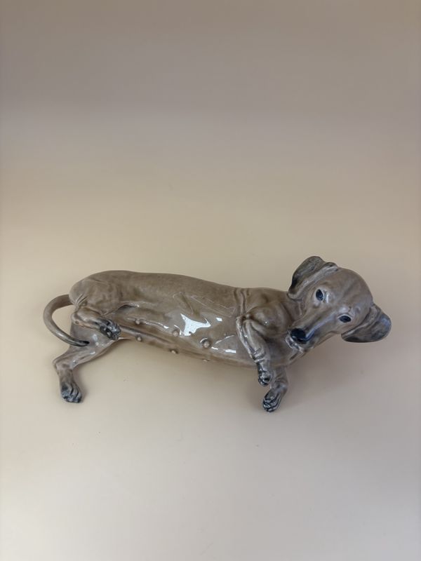Figurine. England.  Heredities. Porcelain Nursing Dachshund Dog. Tan. 6.25&quot;W