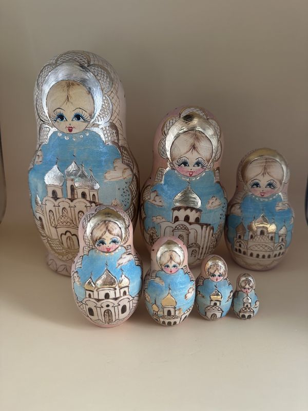 Doll. Russia. Ceprueb Nocag. 7-Piece Russian Matryoshka (Wooden Nesting Doll)  Set. Wood Burned Design &amp; Hand-painting. Beige, Pale Pink, Teal &amp; Silver. 8&quot;H